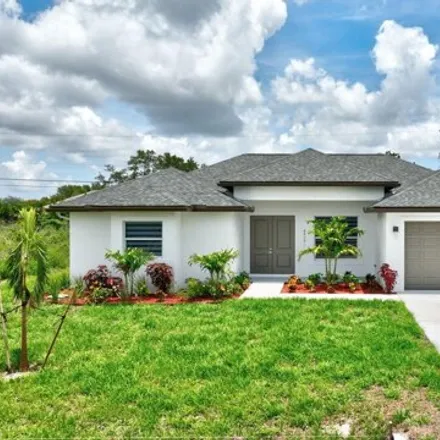Buy this 4 bed house on 4673 SW Keats St in Port Saint Lucie, Florida