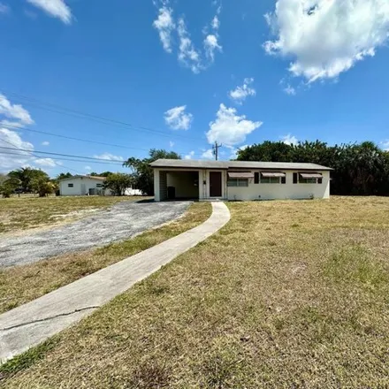 Rent this 3 bed house on 893 West Ilex Drive in Lake Park, Palm Beach County
