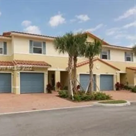 Buy this 2 bed townhouse on 1999 Northwest 31st Court in Middle River, Broward County