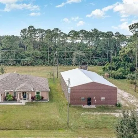 Buy this 5 bed house on 498 Warwick Street Southeast in Palm Bay, FL 32909