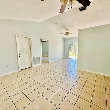 Rent this 3 bed apartment on 698 Concord Street Northeast in Palm Bay, FL 32907