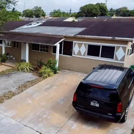 Buy this 5 bed house on 2430 Northwest 180th Terrace in Carol City, Miami Gardens