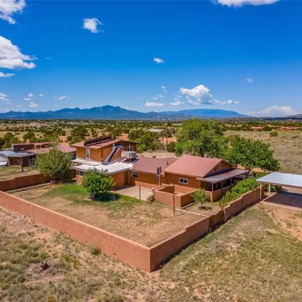 Buy this 4 bed house on Blue Raven Road in Santa Fe County, NM