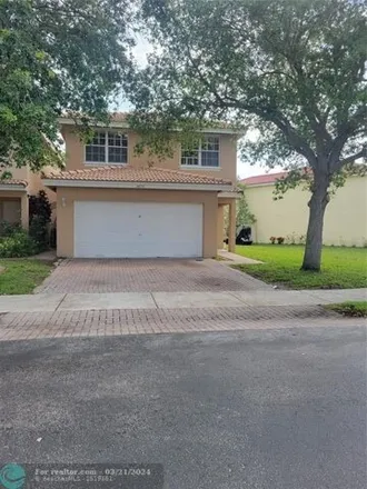 Rent this 4 bed house on 3800 Sienna Greens Terrace in Lauderhill, FL 33319