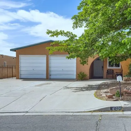 Buy this 4 bed house on 4179 Alcazar Street Northeast in Albuquerque, NM 87109