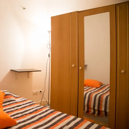 Rent this 4 bed room on Rua de Fernandes Tomás 40-46 in 1200-096 Lisbon, Portugal