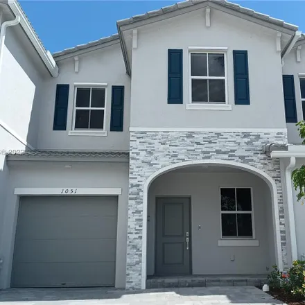 Rent this 3 bed townhouse on Southeast 27th Terrace in Homestead, FL 33033