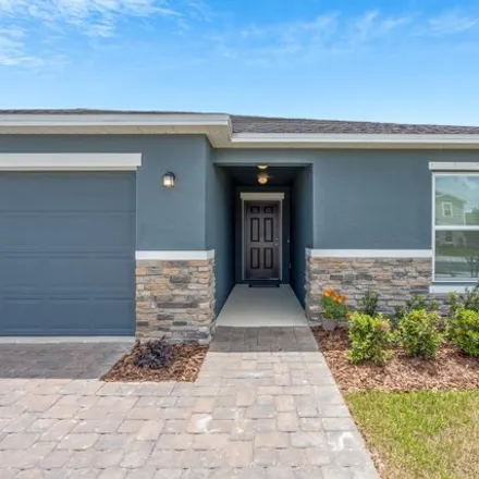 Rent this 4 bed house on Barringer Drive Southeast in Palm Bay, FL 32909
