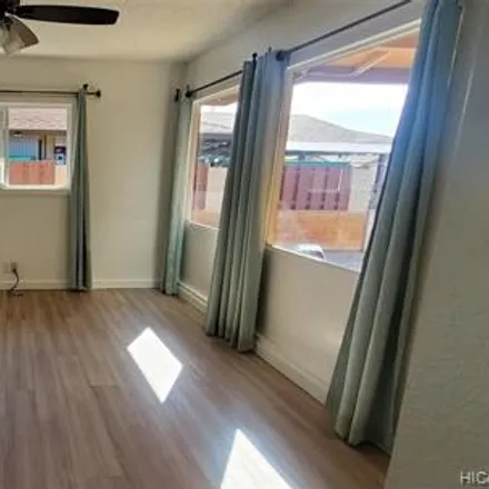 Rent this 3 bed house on Lahaole Place in Waipahu, HI 96797