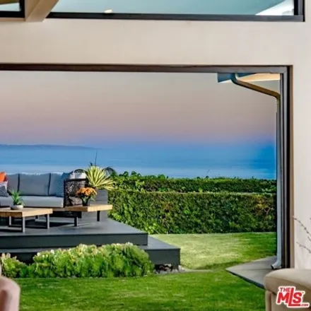 Rent this 4 bed house on 18320 Clifftop Way in Malibu, California