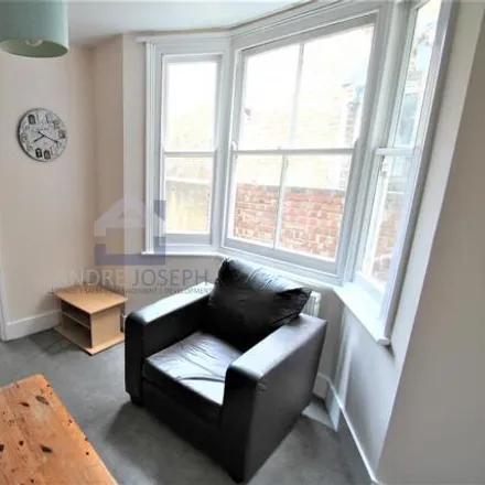 Rent this 4 bed townhouse on Hazelbourne Road in London, SW12 9NX