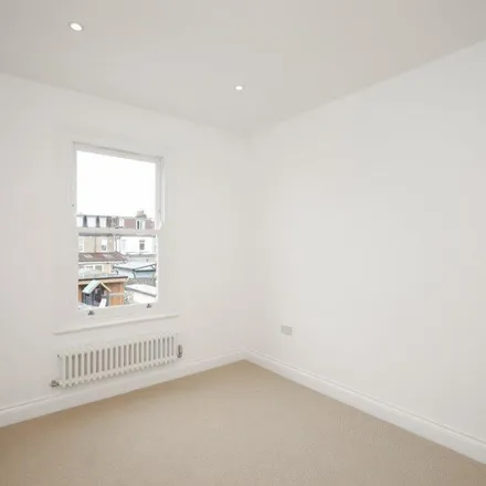 Rent this 3 bed townhouse on Victory Road in London, SW19 1HP