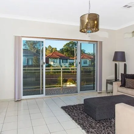 Rent this 4 bed apartment on Northcliffe Drive in Lake Heights NSW 2502, Australia