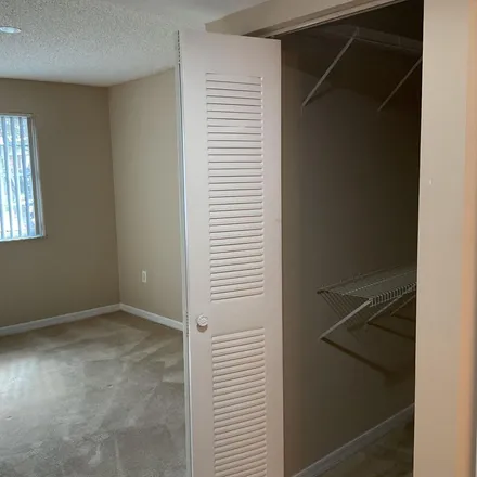 Rent this 3 bed apartment on Earnest Street in West Palm Beach, FL 33417