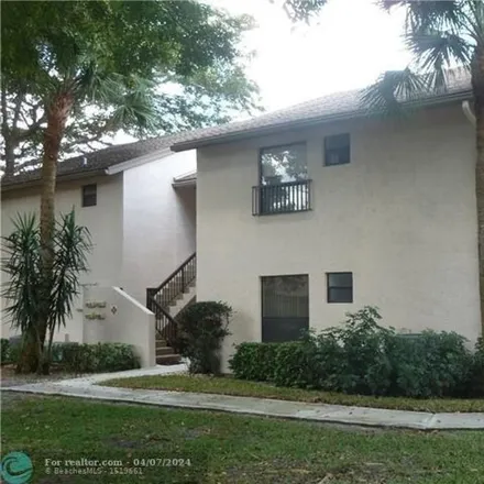 Buy this 2 bed condo on Cocoplum Circle in Coconut Creek, FL