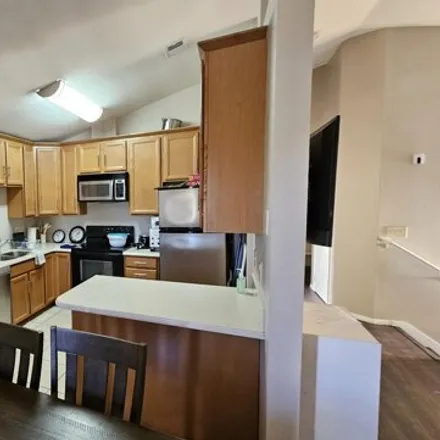 Rent this 5 bed house on South Stonebridge Gardens in Mesa, AZ 85025