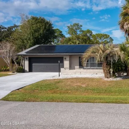 Rent this 4 bed house on 224 Beechwood Lane in Palm Coast, FL 32137