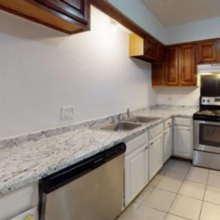 Rent this 3 bed apartment on #a,2117 West Walnut Street in Freeman, Garland