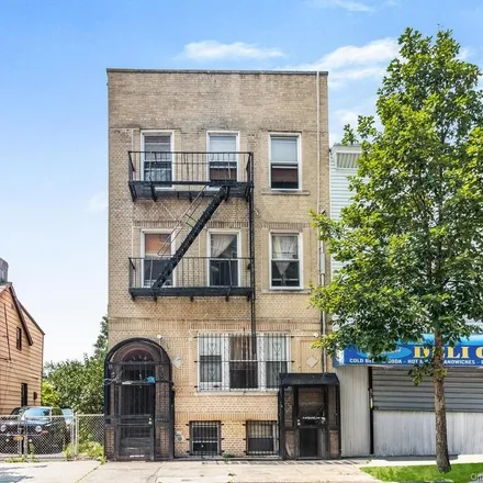 Buy this 14 bed townhouse on 1557 Saint Peters Avenue in New York, NY 10461