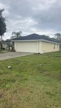 Rent this 3 bed house on 247 Delmonico Street Northeast in Palm Bay, FL 32907