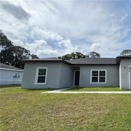 Rent this 3 bed house on 672 Toni Street Southwest in Palm Bay, FL 32908