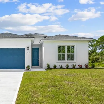 Buy this 4 bed house on 1396 Gibbs Road Southwest in Palm Bay, FL 32908