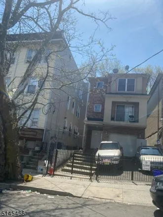 Buy this 6 bed townhouse on 268 West Runyon Street in Newark, NJ 07112