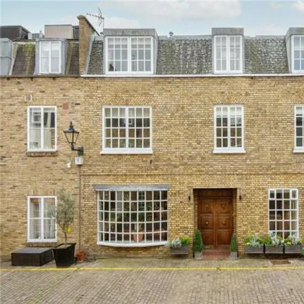 Buy this 3 bed townhouse on 22 Coleherne Mews in London, SW10 9AN