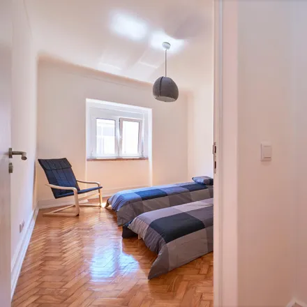 Rent this 5 bed room on Rua da Beneficência 40 in 1600-021 Lisbon, Portugal