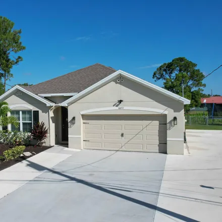 Buy this 4 bed house on 6872 Northwest Hogate Circle in Port Saint Lucie, FL 34983