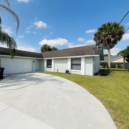 Rent this 3 bed house on 2018 Southeast Parrot Street in Port Saint Lucie, FL 34952