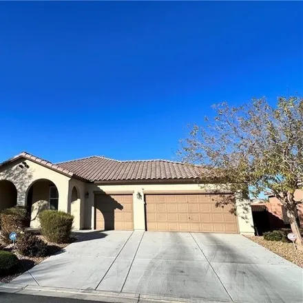 Rent this 4 bed house on 338 Moon Aura Avenue in Paradise, NV 89183