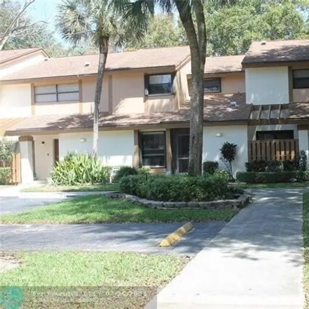 Rent this 3 bed townhouse on Blue Sage Avenue in Coconut Creek, FL 33066