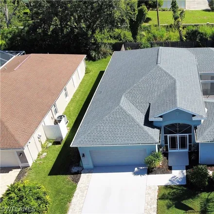 Buy this 4 bed house on 14808 Lake Olive Drive in Cypress Lake, FL 33919