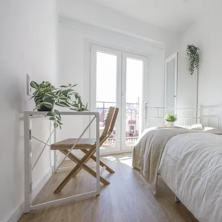 Rent this 3 bed room on Carrer de les Tramoyeres in 45, 46011 Valencia