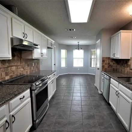 Rent this 4 bed house on 124 Carrington Drive in Fate, TX 75032