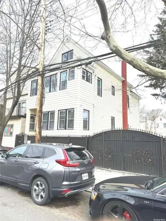 Buy this 5 bed house on 78-29 90th Avenue in New York, NY 11421