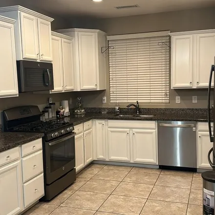 Rent this 3 bed apartment on 9368 West Sweetwater Drive in Peoria, AZ 85381