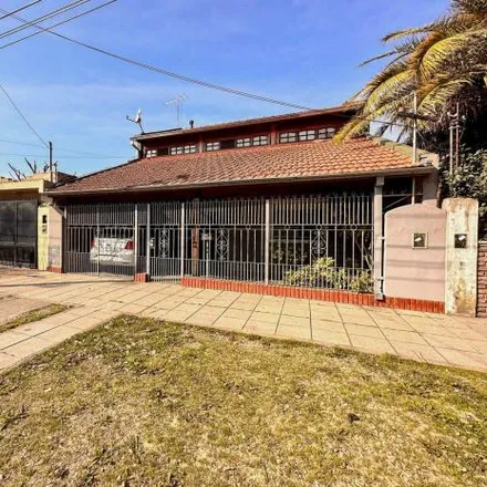 Buy this 5 bed house on Deposito del reparto de diarios Mario Covellone e hijos. in Juan Bautista Alberdi 2725, Partido de Florencio Varela