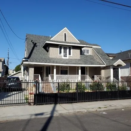 Buy this 8 bed house on 2153 Portland Street in Los Angeles, CA 90007