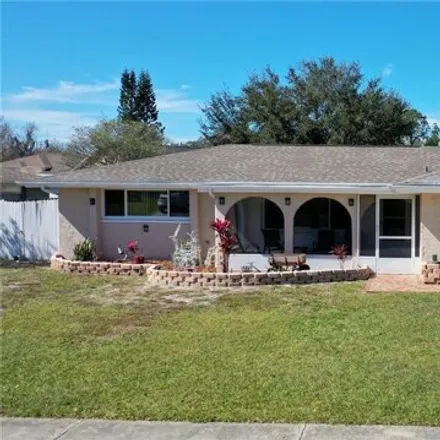 Buy this 3 bed house on 7615 Summertree Lane in Jasmine Estates, FL 34653