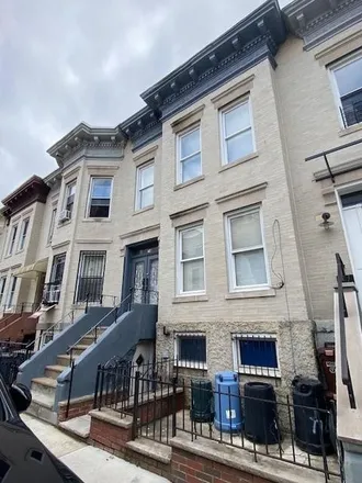 Buy this 6 bed townhouse on 76 Kermit Place in New York, NY 11218