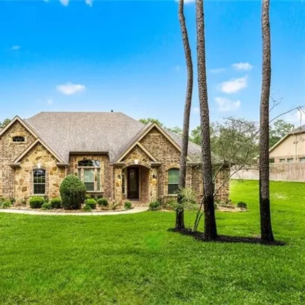 Buy this 4 bed house on 9542 Longmire Oaks Dr in Conroe, Texas