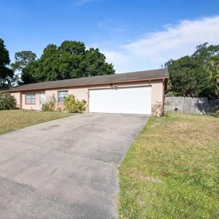 Rent this 3 bed house on 1336 Tilberg Avenue Northwest in Palm Bay, FL 32907