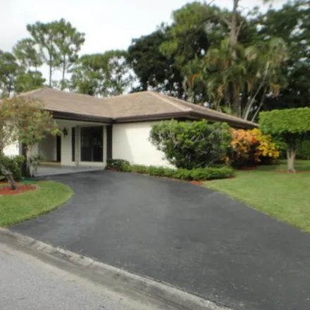 Rent this 3 bed townhouse on 555 Woodland Circle in Atlantis, Palm Beach County