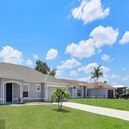Buy this 4 bed house on 1420 Southwest Dow Lane in Port Saint Lucie, FL 34953