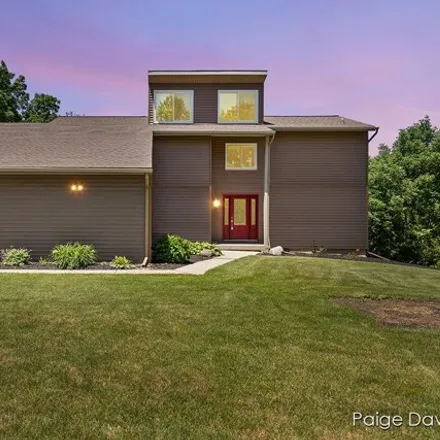 Buy this 4 bed house on 3721 Dunlop Lake Ln NE in Grand Rapids, Michigan