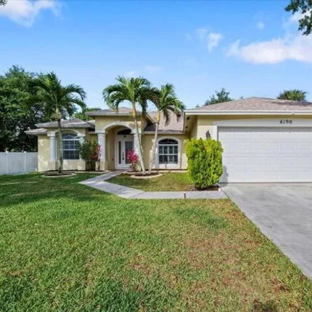 Buy this 3 bed house on 4184 Southwest Utterback Street in Port Saint Lucie, FL 34953