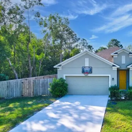 Buy this 4 bed house on 6161 Northwest E Deville Circle in Port Saint Lucie, FL 34986