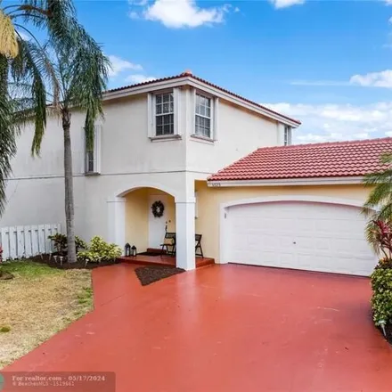 Buy this 3 bed house on Northwest 44th Avenue in Coconut Creek, FL 33073